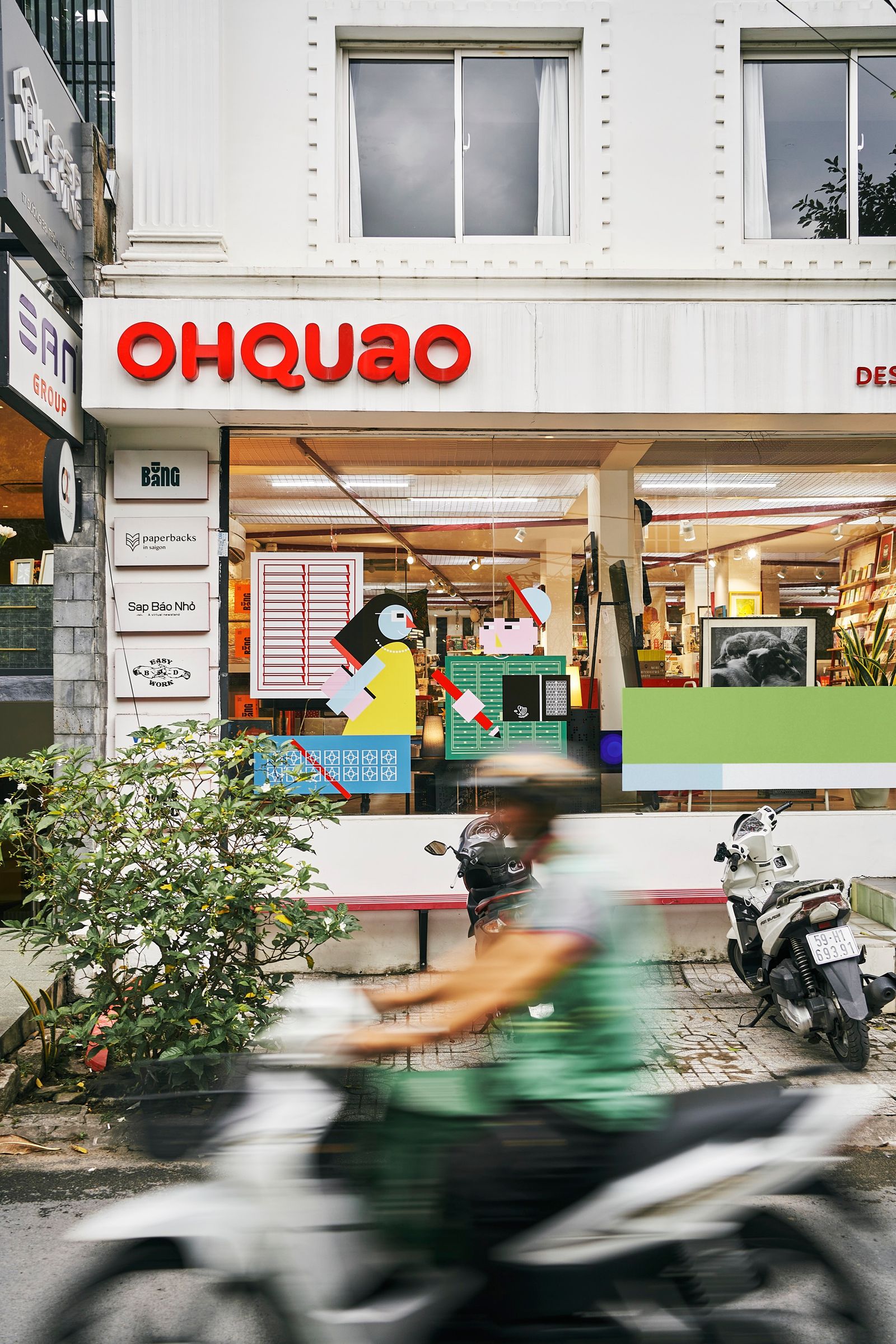 Image may contain Adult Person Shop Shopping Mall Motorcycle Transportation Vehicle Plant Scooter and Urban